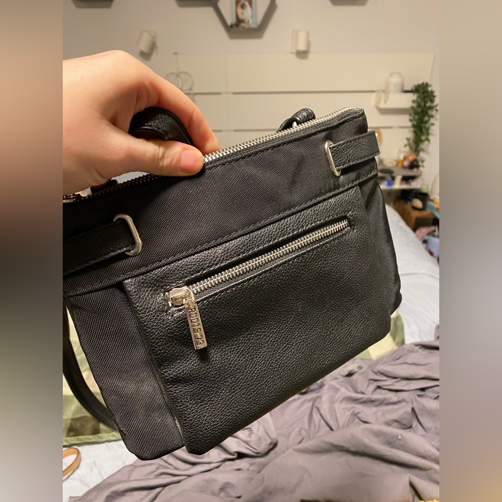 Roots 73 crossbody bag black with two main pockets and two small pockets